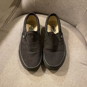 Solid black Vans